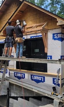 Jimmy on site with blueprints